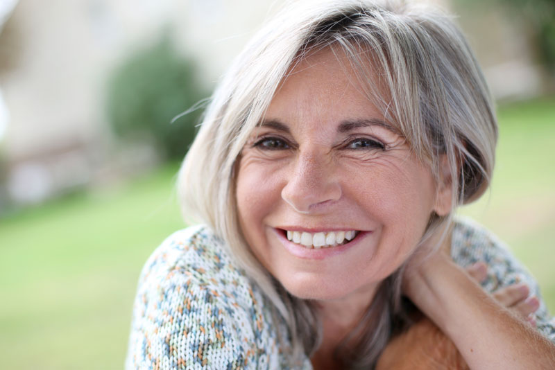 Dental Implant Patient Smiling After A Dental Implant Procedure