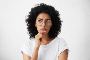 Questioning Dental Patient Wondering About Dental Implant Procedure