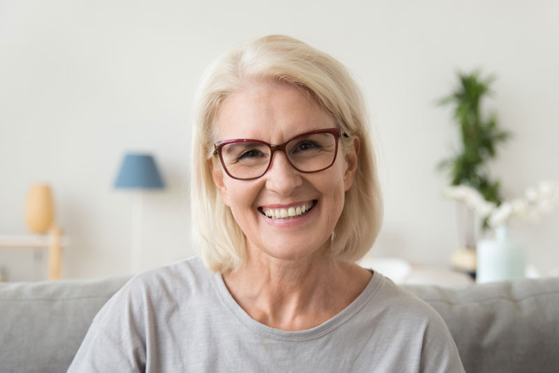 Dental Patient Smiling After Getting Dental Implants In Cedarhurst, NY