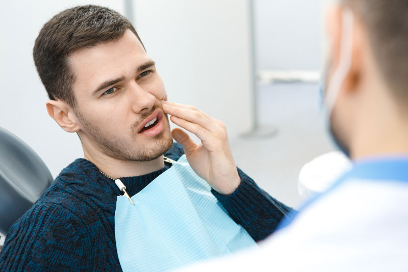 Dental Patient Suffering From Mouth Pain On A Dental Chair, In Cedarhurst, NY