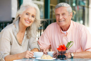 Dental Implant Patients Eating Together With Their False Teeth in Cedarhurst, NY