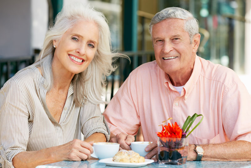 Dental Implant Patients Eating Together With Their False Teeth in Cedarhurst, NY