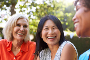 dental patients smiling after receiving new dental implants under sedation.